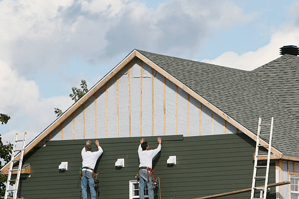 Professional Storm Damage Siding Repair technician working in Ocean Beach, NY